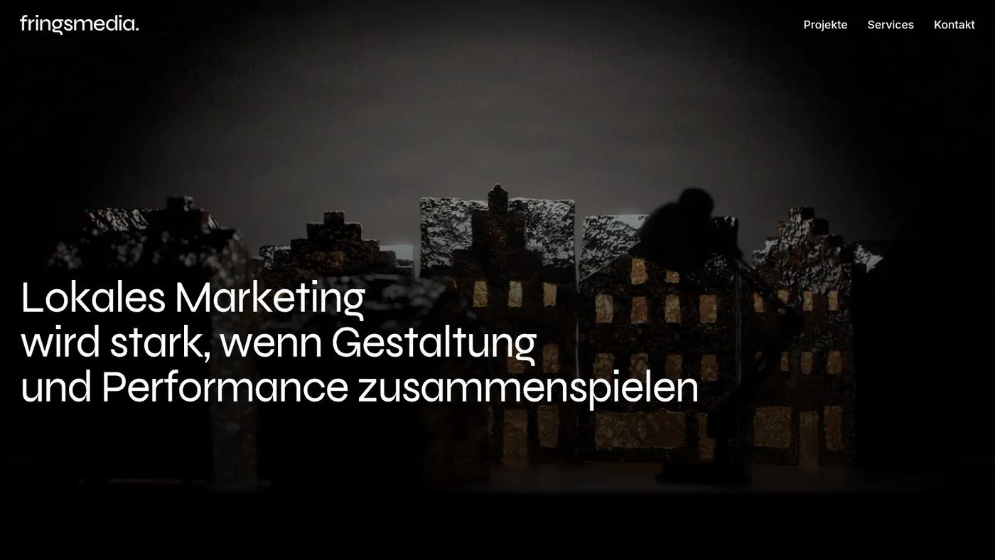 fringsmedia home page: dark hero photo of a model city with a large headline